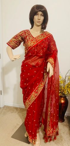 Product code-SA35 Muslin Red designer bridal Saree for Women Fancy Party Wear.Heavy zari embroidery , hand work saree with stitched embroidered Red half sleeve Blouse Falls,Picu, piping tassel work nicely done  * Saree Length: - 5.6 Meter * Blouse- stitched size 38-40  * Blouse is stitched. Saree colour-Red * Saree Comes with stitched Blouse Festive Red Pre-draped Saree With Zari Work, Traditional Red Pre-draped Embroidered Saree, Traditional Red Embroidered Pre-draped Saree, Red Pre-draped Saree With Dori Work, Festive Red Pre-draped Saree With Pallu, Red Pre-draped Saree For Wedding And Transitional Seasons, Red Dola Silk Pre-draped Saree With Dupatta, Red Chanderi Pre-draped Saree With Dori Work, Red Saree For Festive Reception