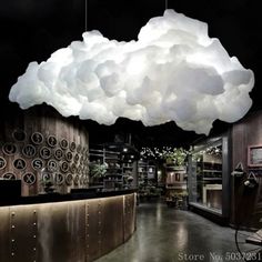 a large cloud hanging over a store filled with items