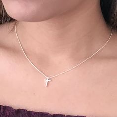 This tiny silver cross necklace is a classic addition to your layering necklaces. This minimalist necklace is also perfect by itself. The cross charm is sterling silver and measures approximately 12 mm in length or 1/2 inch. The chain is delicate looking but sturdy sterling silver. This dainty cross necklace is available in lengths from 15 - 18 inches. You may choose to add an attached extender. Your new necklace will come in a box, ready for gift giving. More Christian jewelry https://www.etsy. Tiny Cross Necklace, Dainty Cross Necklace, Cross Necklaces, Silver Cross Necklace, Horseshoe Pendant, Horseshoe Necklace, Sterling Silver Cross Necklace, Tiny Cross, Small Necklace