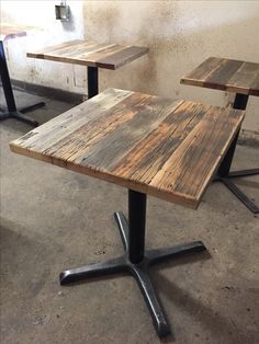 three wooden tables sitting on top of metal legs