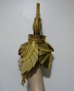 "Cleopatra Gold and Red Headdress, it is made in Strong Eva foam, so light weight, but strong. Decorate with metallic gold trims, jewels, rhinestones trims, beads, fringe gold beads, sequins trim, gold paint and same glitter. The headdress is lining with felt and have adjustable elastic on the back. Fit well until 23\" inches circumference. Please send me your head circumference measurements. Any question let me know. Thank you" Gold Costume Hats And Headpieces For Carnival, Gold Mardi Gras Costume Hats And Headpieces, Gold Crown Costume Hat, Gold Fantasy Costume Hats And Headpieces, Fantasy Gold Headpiece For Costume, Mardi Gras Costume Accessories In Gold, Gold Mardi Gras Costume Accessories, Fitted Gold Costume Hat For Carnival, Gold Tall Crown Costume Hats And Headpieces