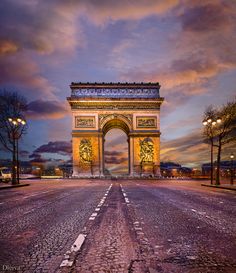 an image of the arc de trioe in paris, france at sunset or dawn