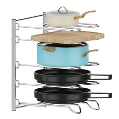 pots and pans are stacked on the rack