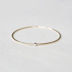 The Birthstone Bangle Yellow Gold - Round – Yearly Company May Emerald, Custom Bangle, Tell Your Story, Stacked Bangles, Gold Bangles, Pink Tourmaline, Heavy Weight, Your Story, Birthstone