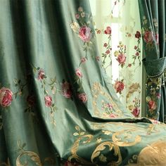 the curtains are covered with floral designs