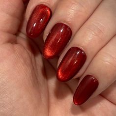 Pictured in Short Round. A vibrant twist on our popular 'Blood Moon' design! These Apres GelX press on nails feature a smooth, silky cat-eye shimmer, set against a rich, solid red base that captures light and depth from every angle. Please note: colors and shine will vary depending on photography, lighting and angles. --MATERIALS AND CRAFTSMANSHIP-- This set is crafted with meticulous care using high-quality UV gel materials, including Après Gel-X tips, Après Gel-X Prep surface primer, base gel, Dark Red Cats Eye Nails, Nails For Christmas Red, Christmas Nails Inspo Short, Dark Red Velvet Nails, Dark Red Cateye Nails, Cats Eye Red Nails, Velvet Christmas Nails, Shimmer Red Nails, Sparkly Nails Red