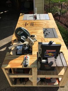 a table made out of pallet wood with tools on it and some other items