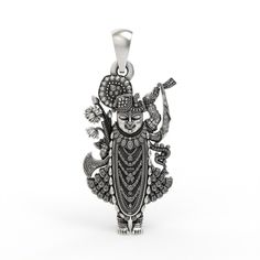 This 925 Sterling Silver Shrinathji Pendant is a beautifully handcrafted devotional piece, perfect for those who cherish their faith and the timeless legend of Shrinathji. According to the legend, the icon of Shrinathji self-manifested from stone and emerged from the Govardhan Hill. Historically, Shrinathji was first worshipped at Govardhan hill near Mathura. To protect it from the Mughal ruler Aurangzeb, the image was moved south on a chariot. When it reached the village of Sinhad in Mewar, the Spiritual Oxidized Temple Necklace, Spiritual Oxidized Necklace For Navratri, Spiritual Oxidized Jewelry For Navratri, Spiritual Oxidized Temple Necklace As Gift, Spiritual Oxidized Finish Temple Necklace As Gift, Sterling Silver Oxidized Temple Necklace Gift, Ceremonial Spiritual Jewelry For Navratri, Spiritual Silver Temple Necklace For Rituals, Silver Spiritual Temple Necklace For Puja