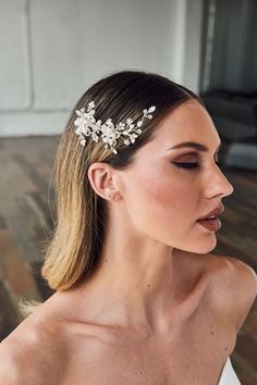 Elegant and sophisticated, this bridal hair comb features two rhinestone flowers embellished with ivory freshwater pearls. The design is completed with cascading sprays of marquise and round jewels, as well as additional pearls. Measuring about 4.75 inches in length and 2 inches in height, it adds a touch of glamour to any bridal look. Prom Hairstyles Braid, Hair For 2023, Pearl Blonde, Hairstyles Braid, Silver Blonde Hair, Prom Hairstyle, Silver Blonde, Prom Hairstyles For Long Hair, Senior Prom