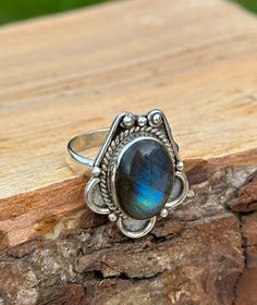 Unveil the mystical allure of our handcrafted Labradorite Ring, a beauty showcasing the iridescent magic of labradorite. Set in sterling silver, each natural labradorite stone is chosen for its unique hues. Known as black moonstone the healing gemstone makes every ring a one-of-a-kind treasure. Perfect for those who adore bohemian elegance or seek the meaningful, mystical charm of handmade jewellery. ➵ Metal: Solid 925 Sterling Silver ➵ US Ring Size: Choose Size ➵ Gemstone: Labradorite (Black Moonstone) ➵ Style: Vintage, Bohemian, Cabochon ➵ Packaging: Sustainable Box (Letterbox) To all the wonderful humans that support my small business... THANK YOU ❤️    **         DELIVERY         ** UK  ➵ 1st Class Signed For - £3.45 (1-2 business days) EU ➵ International Tracked and Signed  - £8.65 (1 Mystical Cabochon Rings As A Gift, Bohemian Handmade Iridescent Rings, Handmade Mystical Iridescent Ring, Mystical Handmade Iridescent Ring, Handmade Iridescent Mystical Ring, Bohemian Handmade Oval Crystal Ring, Handmade Bohemian Oval Crystal Ring, Bohemian Oval Labradorite Jewelry, Handmade Adjustable Iridescent Crystal Ring