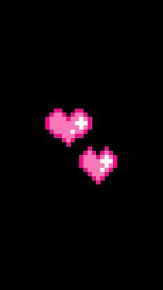 an old - school style video game with two pink pacpions floating in the air