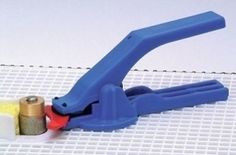 a pair of blue pliers sitting on top of a piece of paper next to a screwdriver