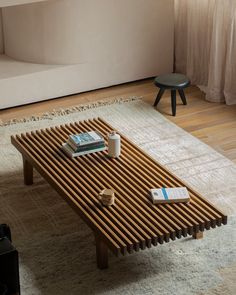 Minimalist teak coffee table with grille design in a cozy living room setting