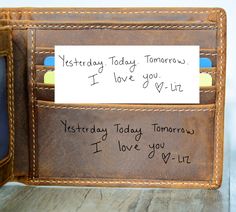 a wallet with writing on it and a note attached to the front pocket that says, today today tomorrow i love you