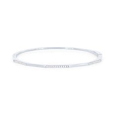 A delicate look perfect for every day wear, this geometric shaped bangle features segments of round brilliant cut diamonds totaling 0.21 carats. Classic White Gold Bangle With Single Diamond, Modern Diamond Bracelet With Diamond Cut, Modern Diamond Cut Diamond Bracelet, Minimalist Bangle With Diamond Accents And Cubic Zirconia, Elegant Single Diamond Bangle Bracelet, Minimalist White Gold Bangle For Everyday Luxury, Timeless Formal Bangle With Single Diamond, Modern White Gold Bangle With Single Cut Diamonds, Timeless Diamond Cuff Bracelet In Bangle Shape