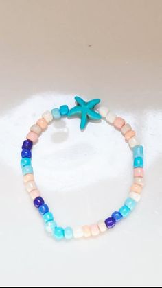 Express summer joy with this Summer Seed Bracelet! It's cute, stylish, and perfect for the warm season. Playful Summer Vacation Jewelry, Blue Bracelets For Summer Beach, Casual Beaded Bracelets For Summer Beach, Trendy Bracelets With Colorful Beads For Beach Season, Summer Beaded Bracelets For Beach, Trendy Colorful Beads Bracelets For Beach Season, Trendy Colorful Beaded Bracelets For Beach Season, Casual Summer Bracelets With Colorful Beads, Cute Adjustable Turquoise Beaded Bracelets