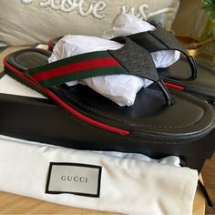 Gucci Web Strap Guccissima Black Leather Thong Flip Flop Sandals Size - Gucci Size 14 - Us14.5 Color - Black/Red/Green Material - Leather/Fabric Insole - Leatger Outsole - Rubber New With Box And Dust Bag Made In Italy Please See All Pictures And Video For Details! Lease Contact If You Have Any Questions Gucci Black Sandals With Single Toe Strap, Luxury Black Leather Flip Flops, Gucci Designer Sandals With Single Toe Strap, Designer Gucci Sandals With Single Toe Strap, Luxury Leather Flip Flops For Beach, Luxury Leather Flip Flops With Single Toe Strap, Designer Leather Flip Flops For Beach, Designer Leather Flip Flops For The Beach, Luxury Leather Open Toe Flip Flops