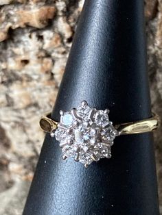 A traditional vintage Diamond cluster ring , 9.25mm  head in diameter ,  8 small sparkling Diamonds approximately 2mm surrounding a central Diamond 3.5mm totalling approximately 50pts  or half a carat , Quality Diamond estimated at VS1 and J colour, , set in a fully Hallmarked 18ct  Gold Mount and band Birmingham 1976, Size O or US 7 Gold Knot Earrings, Diamond Cluster Engagement Ring, Cluster Engagement Ring, Knot Earrings, Classic Gold, Diamond Cluster Ring, Lovely Earrings, Diamond Cluster, Quality Diamonds