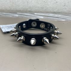 New Unisex Hot Topic Black Chrome Spiked Rocker Biker 3/4” Wide Bracelet Size M/L Adjustable Punk Bracelet For Streetwear, Adjustable Punk Bracelets For Streetwear, Adjustable Black Punk Wristband, Black Band Wristband For Concerts, Trendy Adjustable Spiked Bracelets, Adjustable Punk Bracelets For Biker Events, Black Punk Bracelets For Festival, Punk Black Bracelets With Spikes, Edgy Band Bracelet For Concerts