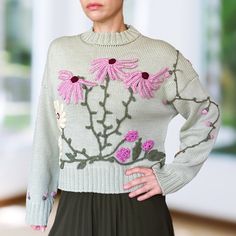 Life is too short to wear boring clothing! The unique embroidered sweater, SANNI, is a one-of-a-kind piece that will truly make you stand out from the crowd. Handcrafted from the highest quality Italian merino yarn, this extremely cozy crewneck features a loose fit and charming 3D floral decorations, creating an eye-catching look. Choose from 11 beautiful colors to perfectly match your personal style. SANNI comes in two sizes: Regular, fitting sizes from M to XL, and Petite, ideal for sizes XS t Embroidered Knit Long Sleeve Sweater, Embroidered Long Sleeve Knit Sweater, Fitted Crew Neck Sweater With Floral Embroidery, Fitted Embroidered Knit Sweater, Fitted Cotton Sweater With Floral Embroidery, Embroidered Crew Neck Knit Sweater, Fitted Embroidered Crew Neck Sweater, Fitted Long Sleeve Embroidered Sweater, Fitted Long Sleeve Sweater With Floral Embroidery