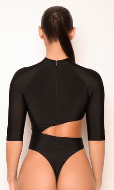 the back of a woman wearing a black bodysuit