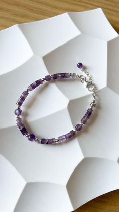 Shiny violet amethyst bracelet. It's original jewelry, beaded by hand, using only natural stone beads. Check my shop to see more matching bracelets:  https://www.etsy.com/shop/JewelsByMuzA?ref=shop-header-name&listing_id=1664043490&from_page=listing§ion_id=47678614 LENGTH: 15 cm + 3 cm chain. CLOSURE: lobster claw. MATERIALS: 4mm faceted amethyst square beads, furniture can be: stainless steel, goldened stainless steel or 925 silver. PLEASE NOTE, COLORS might be different because of the nature o Handmade Sterling Silver Crystal Bracelet For Healing, Sterling Silver Bracelets With Natural Stone Round Beads, Sterling Silver Bracelets With Round Natural Stone Beads, Sterling Silver Crystal Bracelet For Jewelry Making, Sterling Silver Gemstone Beads Bracelet For Jewelry Making, Silver Beaded Bracelets With Natural Stones For Healing, Healing Sterling Silver Beaded Bracelets With Gemstones, Sterling Silver Gemstone Beads Crystal Bracelet Gift, Sterling Silver Gemstone Beaded Bracelets For Jewelry Making