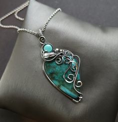 "Handmade wire wrap necklace chrysocolla gemstone, smooth, teardrop  genuine turquoise, round, smooth  herkimer diamond raw point crystal accent  sterling silver wire wrap, oxidized for an antiqued finish, tumbled and hand polished  2 3/4\" pendant length  24\" antiqued silver rolo chain, message me if a different size is needed  comes nicely packaged with a business card, jewelry care instructions and a polishing cloth" Artisan Turquoise Hand Wrapped Necklaces, Artisan Hand Wrapped Turquoise Necklaces, Artisan Hand Wrapped Turquoise Necklace, Bohemian Amazonite Jewelry Gift, Artisan Turquoise Amazonite Jewelry, Artisan Oval Hand-wrapped Jewelry, Artisan Hand Wrapped Oval Jewelry, Unique Turquoise Amazonite Jewelry, Chrysocolla Gemstone Oval Pendant Jewelry