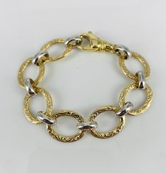 "14K gold hollow link bracelet with alternating yellow engraved links and white smooth links. 7 1/4+ inches in length Nice weight decorative lobster clasp 12.5 grams of 14k gold Excellent like new condition 5/8\" wide links" Gold Link Bracelet Hallmarked, Gold-tone Oval Link Gold Plated Bracelet, Adjustable Gold-tone Link Bracelet, Vintage Yellow Gold Link Bracelets, Vintage Hallmarked Gold Link Bracelet, Black Hills Gold, Pink Ring, Vintage Bracelets, Gold Style