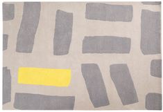 a gray and yellow rug with different shapes on it, including squares and rectangles