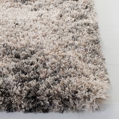 an area rug is shown with white and gray colors