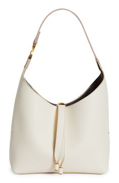 This slouchy calfskin-leather hobo bag blends a modern aesthetic with a '70s folk spirit, and of course has the Marcie line's signature slip-tassel closure. Tassel closure Shoulder strap Interior zip pocket Leather Made in Italy Designer Handbags This brand has B Corp certification, representing business practices with emphasis on social and environmental performance, accountability and transparency This brand meets Nordstrom Responsible Brands criteria: brand adheres to responsible social and e Designer Bucket Hobo Bag With Gold-tone Hardware, Modern Hobo Shoulder Bag With Gold-tone Hardware, Modern Hobo Tote Bag With Gold-tone Hardware, Classic Cream Bucket Bag With Gold-tone Hardware, Versatile Hobo Bag With Gold-tone Hardware For Shopping, Classic White Hobo Bag For Errands, Timeless Hobo Bag With Gold-tone Hardware, Chic Hobo Bag With Gold-tone Hardware For Daily Use, Modern Hobo Bag With Gold-tone Hardware For Daily Use