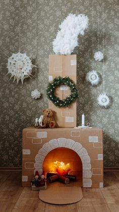 a room with a fire place and decorations on the wall, including wreaths hanging from strings