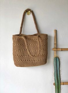 Any woman must have this bag for every fashionista.Whether you keeping it to yourself or gifting someone you care, it will be unforgettable. ✅I made this beautiful bag from camel natural paper rope which is organic cotton. ✅The bag has cotton lining. A lining of the appropriate color is sewn into the crochet paper bag. ✅ The interior of the straw summer bag has a magnetic button. Suitable for use as shoulder bag, beach bag or party bag. ✅You can combine your clothes with a straw summer bag on su Vacation Jute Crochet Shoulder Bag, Jute Crochet Bag For Daily Use, Elegant Vacation Crochet Bag With Open Weave, Elegant Beige Crochet Bag With Natural Fiber, Rectangular Jute Crochet Bag For Daily Use, Elegant Open Weave Crochet Bag For Vacation, Daily Use Rectangular Jute Crochet Bag, Bohemian Everyday Bags With Open Weave, Elegant Crochet Bag With Open Weave For Beach