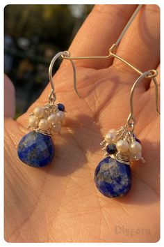 Crafted with celestial elegance, our lapis lazuli and pearl eardrops exude a sense of serenity and grace. #lapisearring#dropearring#wirewrap#silverearring#beachstyle#boohojewelry Elegant Silver Teardrop Wrap Earrings, Delicate Nickel-free Earrings As Gift For Her, Unique Dangle Wrap Earrings, Elegant Handmade Adjustable Wrap Earrings, Elegant Adjustable Silver Wrap Earrings, Wire Wrapped Drop Chandelier Earrings As Gift, Wire Wrapped Chandelier Drop Earrings For Gift, Wire Wrapped Drop Jewelry For Party, Artisan Jewelry With Pearl Drop For Gift