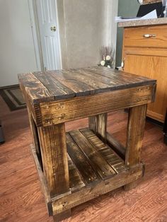 a wooden table sitting on top of a hard wood floor