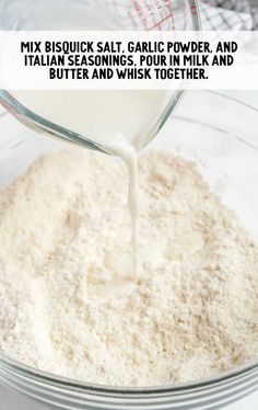 a glass bowl filled with milk being poured into it's mixtures and the words mix biscuit salt, garlic power and italian seasonings pour in milk and butter and butter and whisk together