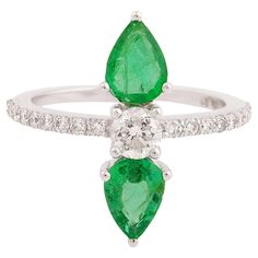 At the center of this ring lies a genuine pear-shaped emerald gemstone, prized for its vivid green hue and exceptional clarity. Mined from the depths of the earth, this precious gemstone exudes a sense of natural beauty and vitality, evoking the lushness of a verdant forest. The ring is a size 7 US and may be resized to larger or smaller upon request. FOLLOW SPECTRUM JEWELS storefront to view the latest collection & exclusive pieces. Spectrum Jewels is proudly rated as a Top Seller on 1stDibs wi Jewelry Details, Zambian Emerald, White Gold Jewelry, Diamond Rings Bands, Emerald Stone, Emerald Gemstone, Ring Diamond, Natural Emerald, Belleza Natural