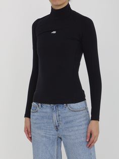 Black long-sleeved high-collar top in matte spandex featuring a printed Activewear logo on the front. Visible topstitching. Tight fit. Size nationality: US Product number: 7774508 Product code: 7970414E2B91081 Composition: 58% polyamide, 42% elastane Sleek Black Long Sleeve Turtleneck, High Stretch Mock Neck Top With Thumbholes, Sleek Long Sleeve Top With Thumbholes, Black High Stretch Funnel Neck Top, Long Sleeve Turtleneck Top With Thumbholes, Fitted Turtleneck Long Sleeve Top With Thumbholes, Fitted Long Sleeve Turtleneck Top With Thumbholes, Versatile Fitted Long Sleeve Turtleneck, Fitted Long Sleeve Versatile Turtleneck