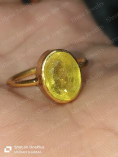 Yellow sapphire, also known as "Pukhraj" in Hindi, is a gemstone that belongs to the corundum family, just like blue sapphire. It is the yellow variety of corundum and is valued for its vibrant yellow color. Yellow sapphire is composed of aluminum oxide (Al2O3) with traces of iron that give it its yellow hue. The color of yellow sapphire can range from pale yellow to intense golden yellow. The most prized and valuable yellow sapphires typically exhibit a pure, vibrant yellow color without any hi Gold Yellow Sapphire Ring Gift, Gift Yellow Sapphire Birthstone Ring, Yellow Sapphire Gemstone Rings As Gift, Gift Yellow Sapphire Gemstone Rings, Yellow Sapphire Ring Jewelry Gift, Yellow Sapphire Birthstone Ring For Gifting, Yellow Sapphire Birthstone Ring Gift, Gift Rings With Yellow Sapphire Gemstone, Yellow Sapphire Birthstone Ring As A Gift