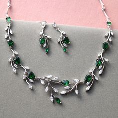 Wedding jewelry set  Prom jewellery set Color: rhodium-silver tone/clear/green Measurements: earrings approx 3.6 cm(not large very delicate) necklace approx 17.5  inches see pictures Materials: rhodium over brass findings, clear /green  zirconia crystals. PACKAGING:simple as in stock at this moment. WEDDING/prom JEWELRY: https://www.etsy.com/uk/shop/WeddingJewelryOutlet?ref=seller-platform-mcnav&section_id=26786154 WEDDING HEADPIECE: https://www.etsy.com/uk/shop/WeddingJewelryOutlet?ref=simple-s Wedding Jewelry Emerald, Brides Jewelry Ideas Necklace, Silver And Green Necklace, Green And Silver Wedding, Green And Silver Earrings, Crystals Packaging, Prom Jewellery, Bridal Jewelry Ideas, Period Jewelry