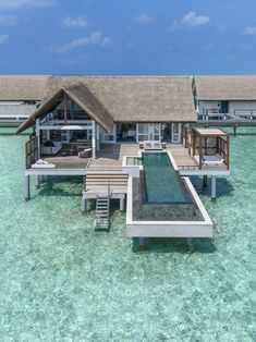 an over water villa on stilts in the ocean