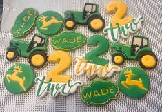 there are many decorated cookies that say two three wade and tractor with deer on them