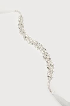 The Lulus Sweetest Ending Silver Rhinestone Bridal Belt is the perfect touch for your special day! Look absolutely gorgeous with this belt that features sparkling, clear glass rhinestones (in silver settings) that shape an abstract, floral-inspired design. Sheer ribbons tie together at the back for an elegant finish. 88" Long. Embellishment Measures 18" Long And 1. 25" Wide. 45% Copper, 45% Glass, 10% Polyester. Imported. Lulus | Sweetest Ending Silver Rhinestone Bridal Belt. Bridal Belt, Rhinestone Bridal, Ribbon Tie, Silver Rhinestone, Your Special, Clear Rhinestones, Abstract Floral, Special Day, Clear Glass