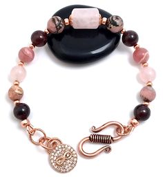 This Spiritual Diva Jewelry, Soulmate, energy healing crystal and copper Reiki adjustable bracelet carries the vibration to attract love, your soulmate and improve existing relationships. The vibrations of these stones help clear and fine tune your energies, making it possible for your intentions to be broadcast. Each stone carries a unique property that when combined,creates a powerful signal to open your heart chakra to love . Copper easily transfers energy, which makes it a powerful metal tha Adjustable Rose Quartz Rose-colored Jewelry, Adjustable Rose Quartz Jewelry In Rose Color, Adjustable Rose Quartz Jewelry For Valentine's Day, Rose Gold Rose Quartz Bracelets For Jewelry Making, Rose Gold Bracelets With Natural Stones For Jewelry Making, Elegant Rose Quartz Bracelets For Valentine's Day, Elegant Rose Quartz Bracelet For Valentine's Day, Soulmate Energy, Infinity Charm Bracelet