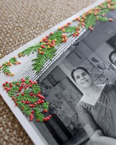 an old photo with red and green sprinkles on it is laying on the floor