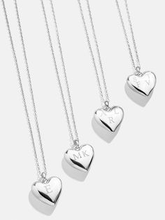 Design a special memento to represent those closest to your heart. The Puffy Heart Sterling Silver Custom Pendant Necklace features a three-dimensional heart charm with the option to add 1-4 engraved letters of your choosing. Add the initials of each of the members of your family, you and a few loved ones, or even just your own - the options are endless. Better yet, this piece is crafted with sterling silver, meaning it'll last you a lifetime. Silver Necklace With Initial Pendant And Heart Charm, Personalized Heart Pendant Jewelry With Heart Charm, Personalized Heart Charm Pendant Jewelry, Initial Pendant Necklace For Keepsake, Personalized Heart Pendant Jewelry, Silver Heart Charm Necklace For Memorial, Sterling Silver Heart Charm Necklace For Memorial, Heart Shaped Engraved Charm Necklaces For Keepsake, Heart-shaped Engraved Charm Necklaces For Keepsake