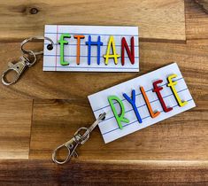 "Our personalized school keychains are perfect to add to any backpack, teacher bag, lunchbox or just a keyring.  Dimensions: Width: 3\" Height: 1.5\" You can also choose a solid color from our color chart.  *If you are interested in another color that is not shown, contact me and I will try my best to accommodate you. Please if you have any questions, don't hesitate to contact us! Not seeing the size you want? Contact us for a custom order! Follow us on Follow us on Facebook and Instagram! www.facebook.com/groups/516251446687180 @thesassydesigns @instagram  The backs of all our signs are left unfinished. The wood is 1/8 thick and layered with 1/8 inch laser cut pieces to create dimension, unless otherwise stated up above." Personalized Gift Standard Backpack For Back To School, Backpack Tags Back To School, Rectangular Multicolor Keychains For School, Customized Rectangular Keychains For School, School Keychains, Transportation Tags For Backpacks, Customized Multicolor Keychains For School, Backpack Name Tags, Preschool Backpack