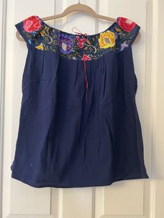 This Beautiful Off the Shoulder Blouse  is the perfect for a fun day out or stay home.  It's made out of cotton manta has an elastic waist and is full of vibrant embroidered florals.  This blouse comes in size S -L   All the blouse are final sale  Unique Colors and embroidery as showed in the pictures. Spring Cotton Off-shoulder Top With Ruffles, Bohemian Off-shoulder Blouse With Ruffles, Bohemian Tops With Embroidered Hem In Relaxed Fit, Bohemian Tops With Embroidered Hem And Relaxed Fit, Casual Embroidered Top With Boho Collar For Spring, Bohemian Off-shoulder Summer Tops, Bohemian Off-shoulder Blouse For Beach, Bohemian Summer Blouse With Relaxed Fit, Summer Floral Embroidery Tops For Day Out