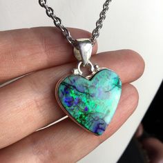 Lab made 'Monarch Opal' heart necklace, with sterling silver bezel, on your choice of stainless steel chain.  Pendant size: approx 1" x 1" Ships in a black gift box ..: V I E W   S H O P:.. www.lotusfairy.etsy.com www.shopEarthshine.com ..: P O L I C I E S :.. Please see the drop down FAQs menu All items are FINAL SALE. ★ I M P O R T A N T ★ This product is not intended to be used by, or around,  anyone under the age of 13.  ShopEarthshine.com ★ lotusfairy.etsy.com  Canadian buyers:  Prices show Green Heart-shaped Sterling Silver Jewelry, Green Sterling Silver Heart Jewelry, Nickel-free Stainless Steel Heart Pendant Jewelry, Heart-shaped Large Pendant Jewelry For Anniversary, Heart Shaped Large Pendant Jewelry For Anniversary, Stainless Steel Heart Pendant Jewelry For Gifts, Stainless Steel Heart Pendant Jewelry As Gift, Unique Silver Heart Necklace For Gift, Heart Cut Stainless Steel Jewelry For Gift