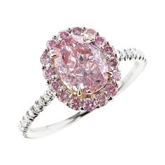 A beautiful and elegant ring centered with a natural oval-shape, Fancy Purplish Pink diamond, accented with a cluster of round brilliant-cut pink diamonds, with white round brilliant-cut diamonds along the shank. The center stone accompanies a gemological certificate from GIA stating the color as Fancy Purplish Pink, with natural and even color, stamped P950 and 750, size 6 1/2 US. Pink Diamond Halo Ring, Pear Cut Diamond Ring, Top Engagement Rings, Pink Diamond Ring, Future Engagement Rings, Pink Diamonds, Platinum Diamond Engagement Rings, Handmade Engagement Rings, Pink Sapphire Ring